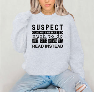 PREORDER SUSPECT CLAIMS SHE HAS SO MICH TO DO BUT SHE SITS DOWN TO READ INSTEAD