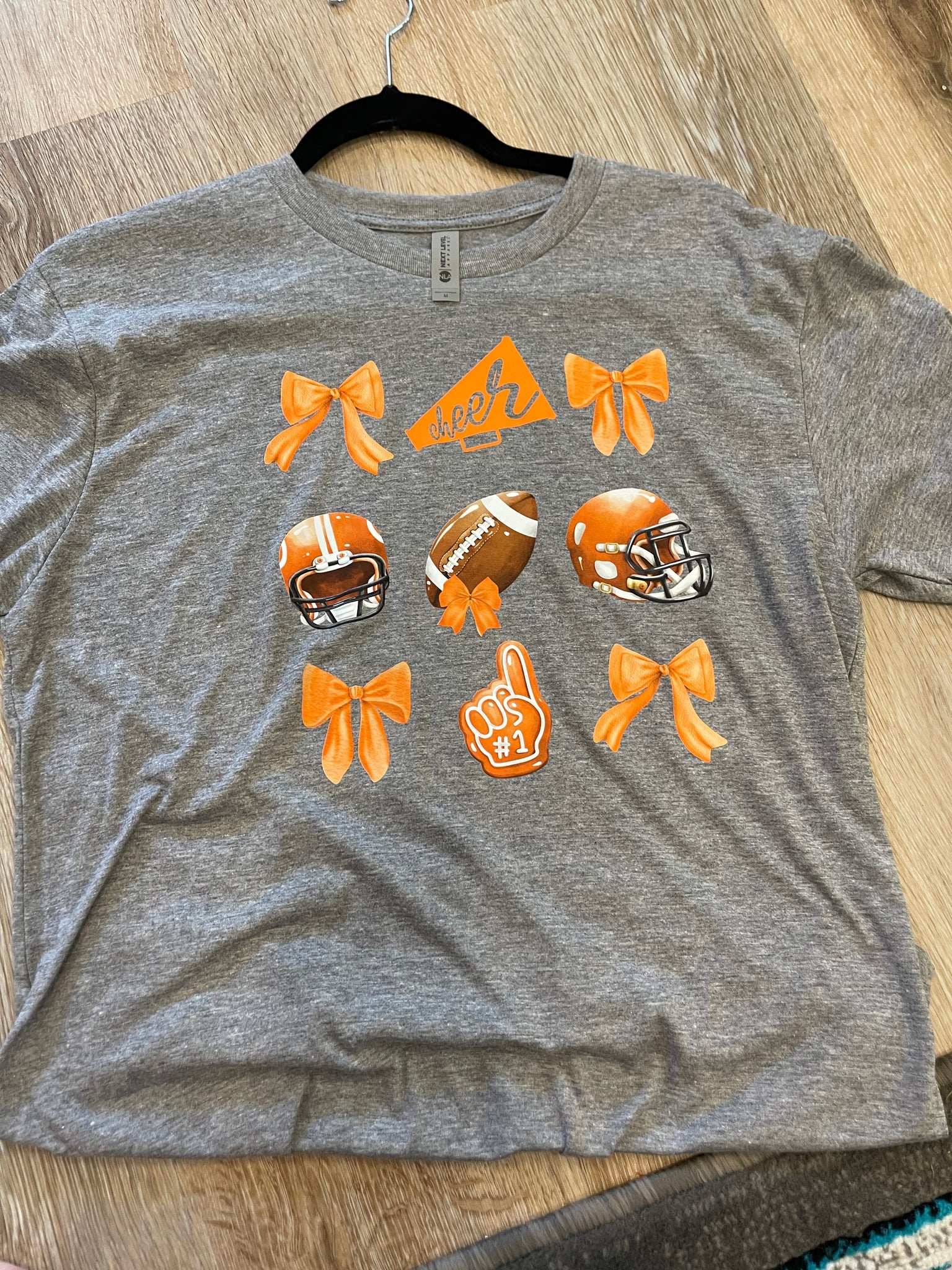 INSTOCK ORANGE BOW FOOTBALL. MEDIUM
